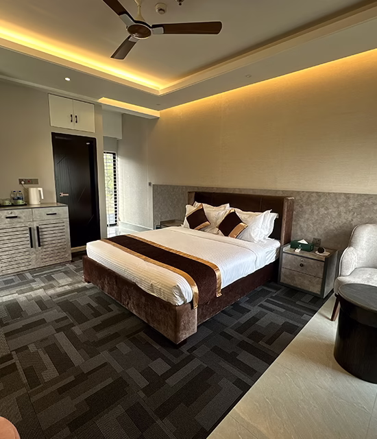 Premium resort bedroom with modern decor and comfortable seating area