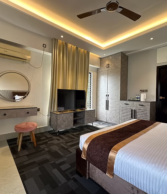Luxury resort bedroom with modern interior, king bed, TV, and air conditioner