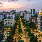 Short stay apartment in Banani Dhaka surrounded by modern residential buildings and tree-lined streets at sunset